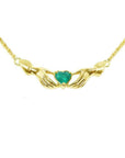 14K yellow gold Claddagh necklace with a deep green heart-cut emerald.