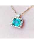 Real emerald necklace for sale east west orientation, crafted in 14k yellow gold