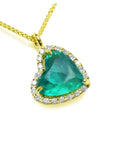 18k yellow gold tilted heart emerald necklace with a halo diamond