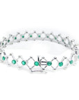 14K white gold bracelet with round Colombian emeralds bezel-set in diamond-shaped links.