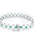 14K white gold bracelet with round Colombian emeralds bezel-set in diamond-shaped links.