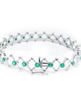 14K white gold bracelet with round Colombian emeralds bezel-set in diamond-shaped links.