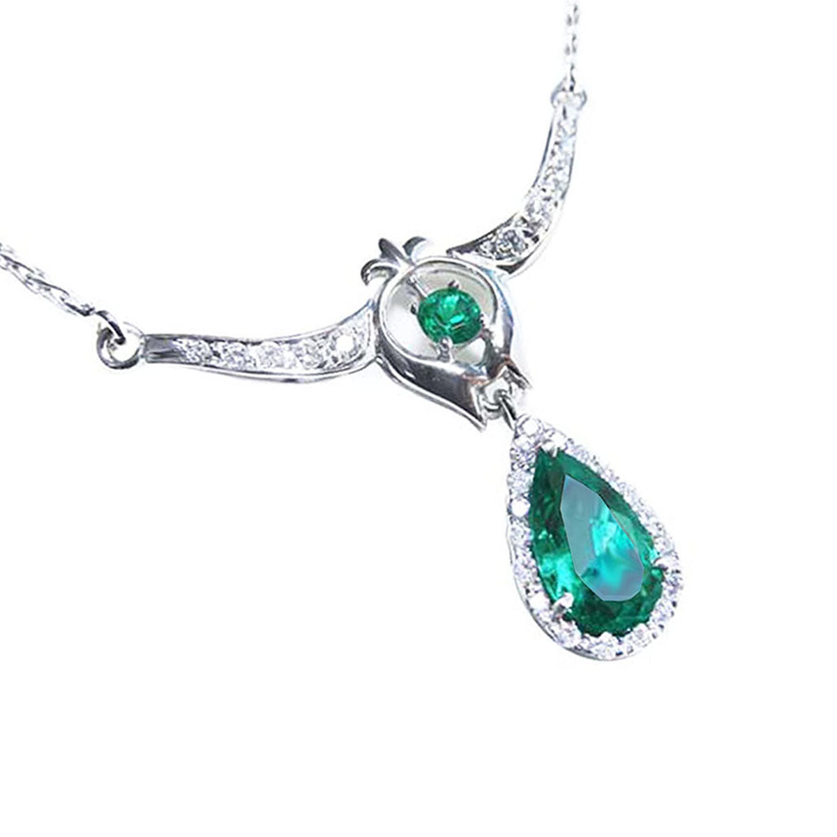 Close view of a natural emerald necklace pear-shaped, accented by natural diamonds 14k white gold