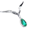 Pear cut emerald necklace sourced from Muzo mines in a halo diamond crafted in 14k white gold.