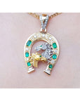 From Muzo natural emeralds horseshoe pendant and natural diamonds crafted in 18k yellow gold