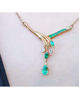 A closer view of a Mother's Day gift emerald and diamond necklace blended pear shaped marquises and round cuts