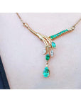 14K yellow gold necklace with marquise and pear shaped Colombian emeralds and diamonds.