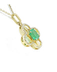 14K gold clover pendant with a square emerald and diamond accents on a delicate chain.