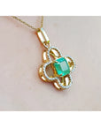 14K gold clover pendant with a square emerald and diamond accents on a delicate chain.