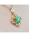 14K gold clover pendant with a square emerald and diamond accents on a delicate chain.