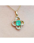 14K gold clover pendant with a square Colombian emerald and natural diamonds on a chain.