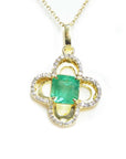 14k gold pendant with a natural colombian emerald and diamonds on a four-leaves clover design.