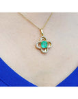 14K gold clover pendant with a square Colombian emerald and diamond accents on a chain.