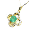14K gold clover pendant with a square natural emerald and diamond accents.
