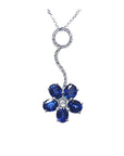 Frontal position of a cluster of natural sapphires pendant white gold necklace full top view
