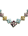 18K white gold necklace with X-cluster links, featuring tri-colored topaz and diamond accents.