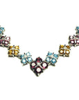 18K white gold necklace with X-cluster links, featuring tri-colored topaz and diamond accents.