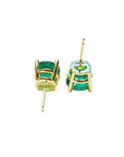 Upside down position of a pair of Muzo Colombian emerald stud earrings on a white background