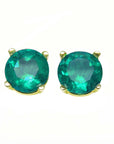 Pair of emerald round cut prong set earrings on a front side position, tables and crowns of the gems are clearly visibles