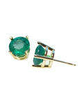 Round bluish-green Colombian emerald stud earrings in 14K yellow gold prong settings.