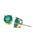 Round bluish-green Colombian emerald stud earrings in 14K yellow gold prong settings.