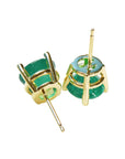 Tow poses upside down of a pair of yellow gold emerald stud earrings underside view push backs
