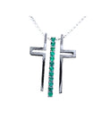 14K white gold cross pendant with a vertical row of round-cut Colombian emeralds on a delicate chain.