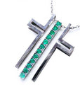 White gold necklace with round emeralds on a white background.