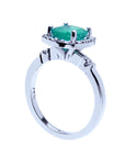 This white gold emerald ring shows the top cushion cut setting and band on a half side position.