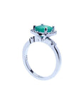 1.71 ct. Colombian emerald cushion cut ring with diamond halo in 14K white gold.