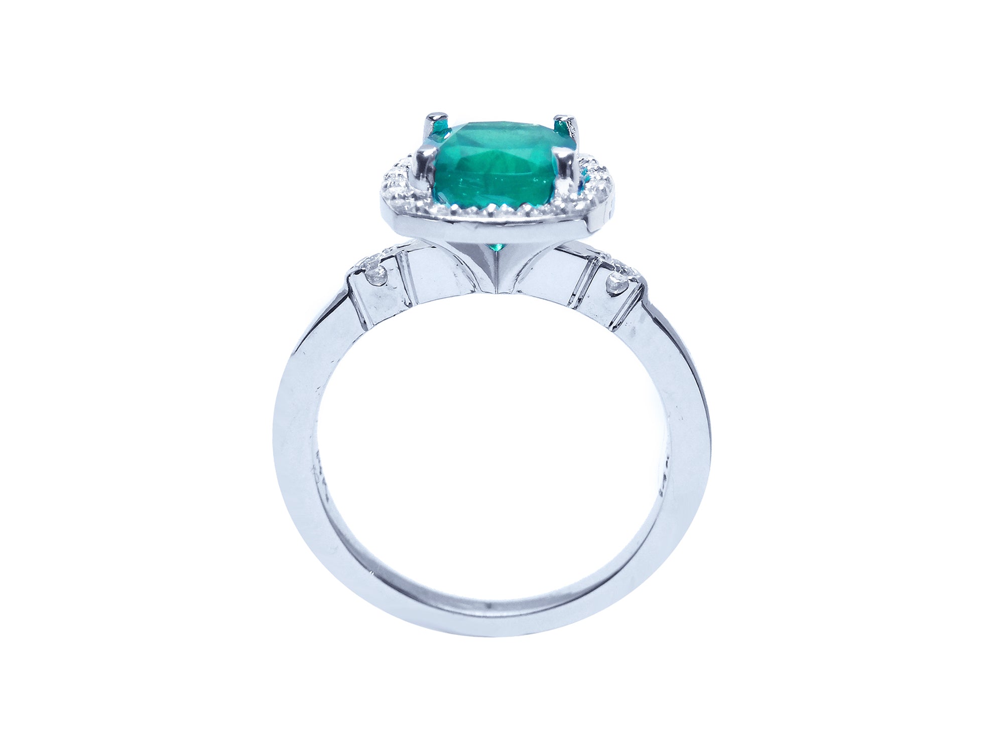 The natural colombian emerald ring displaying the top setting, gallery and band in white gold.
