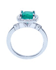 The natural colombian emerald ring displaying the top setting, gallery and band in white gold.