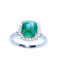 Women's ring with a cushion cut natural colombian emerald with a halo diamond, white gold.