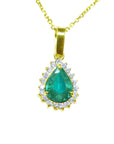 Gold pendant with a natural teardrop colombian emerald on a topside position view.