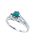 14K white gold ring with a 0.33 ct. oval-cut Colombian emerald and baguette diamond accents.