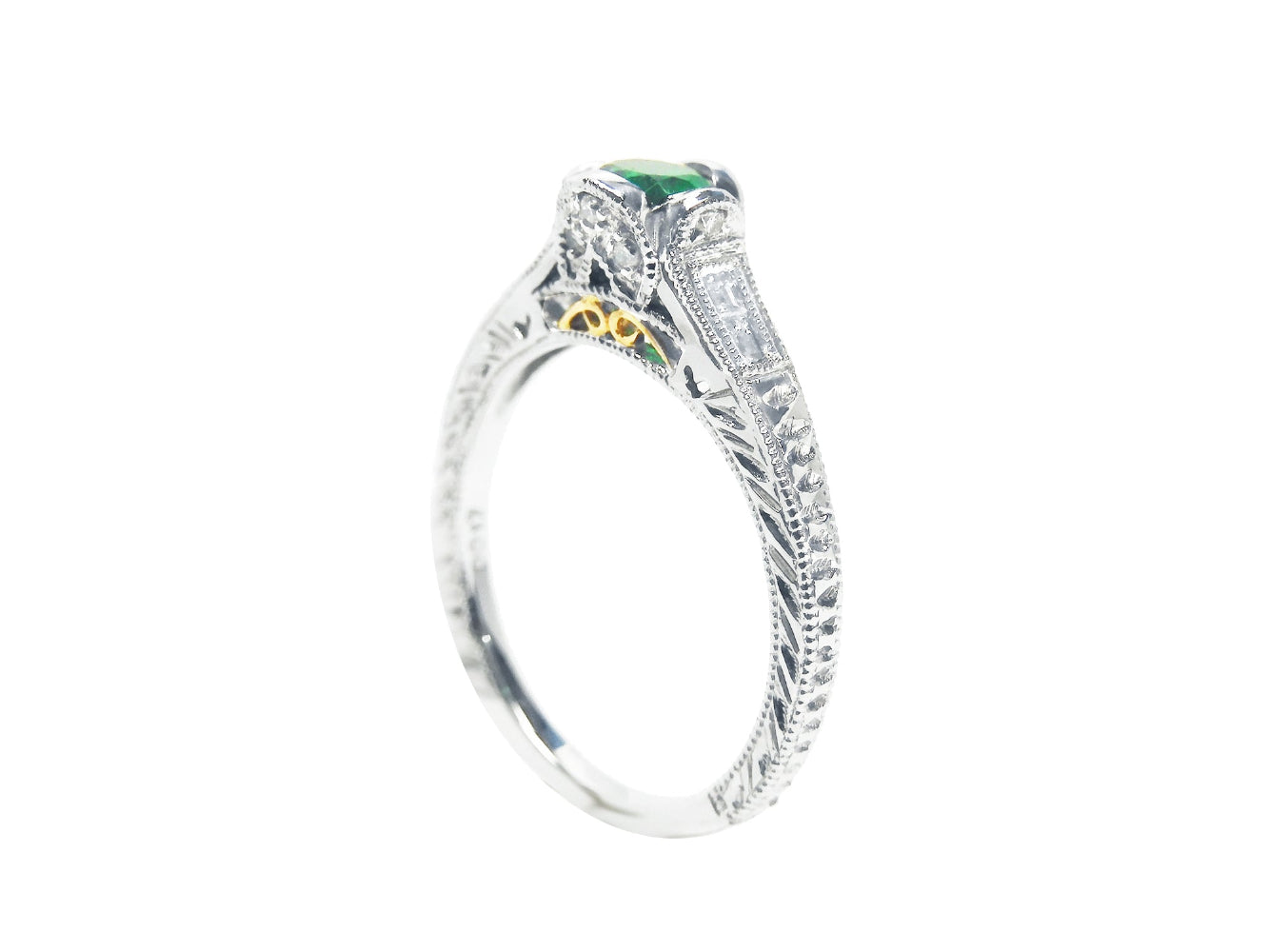 This emerald ring position displays the top and side profile  perspective.
