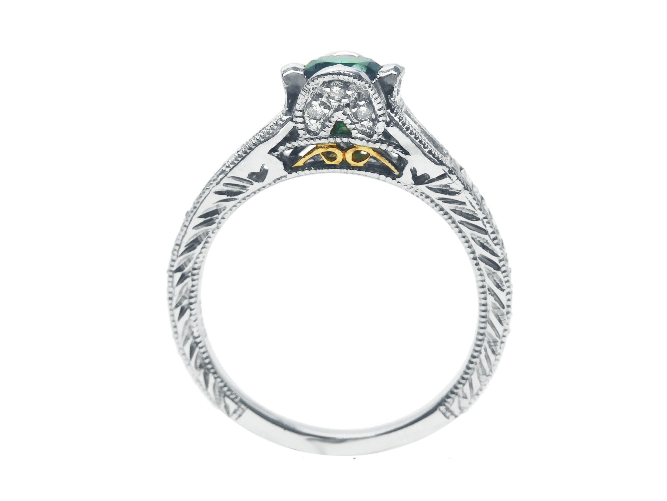 This bridal design natural oval cut colombian emerald ring in white gold shows the top and gallery profile