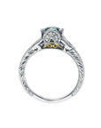 Oval-cut Colombian emerald ring in 14K white gold with diamond accents and intricate band engraving.