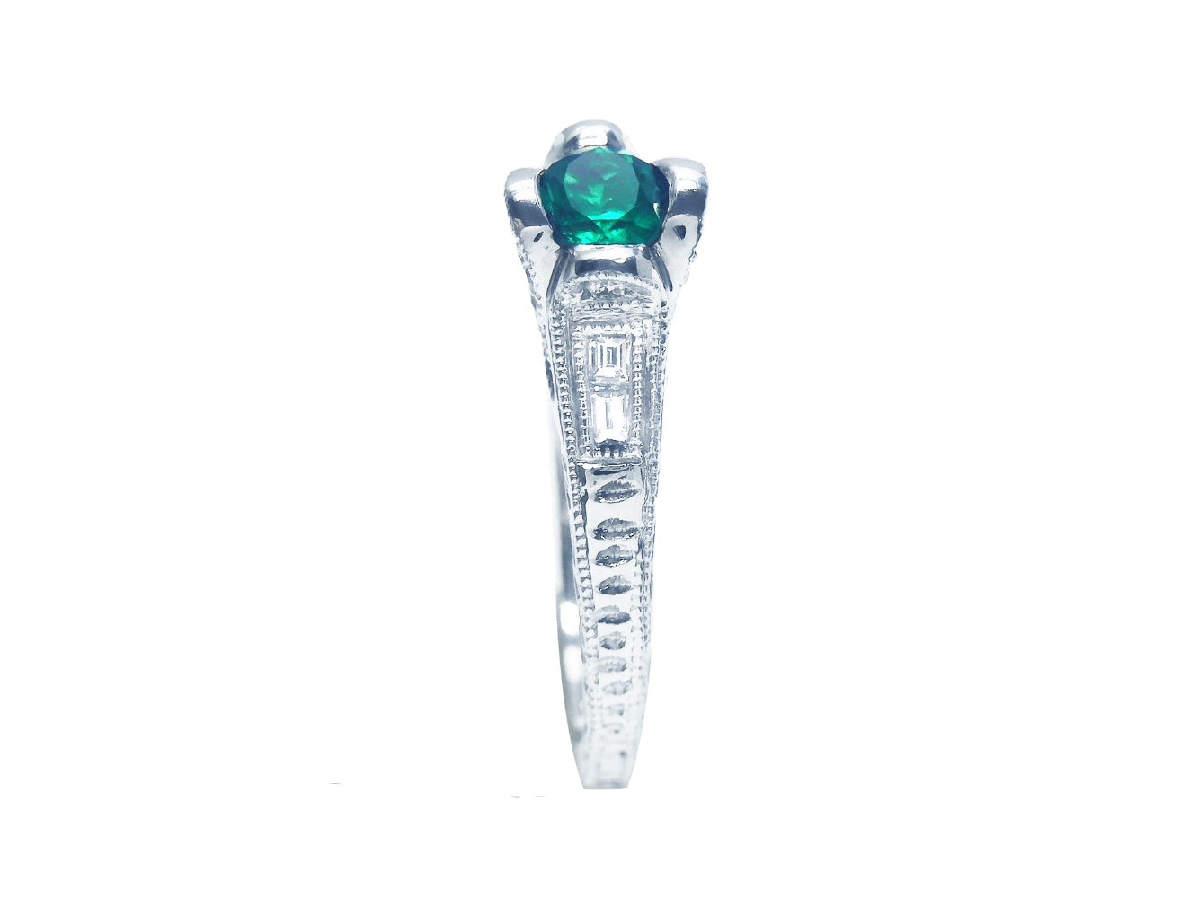 This oval cut colombian emerald ring spectacular view of the top and side profile perspective.