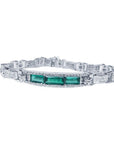 This bracelet features 2.95 carats of vibrant Colombian Muzo emeralds paired with 3.28 carats of natural princess cut diamonds.