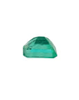A loose colombian emerald displaying its pavilion upside down.