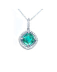 Emerald pendant with diamond halo on a white gold chain topside visible.