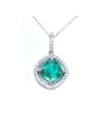 Cushion-cut Colombian emerald pendant with diamond halo in 14K white gold, on a delicate chain.