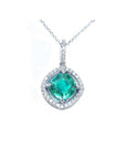 Cushion-cut Colombian emerald pendant with diamond halo in 14K white gold, on a delicate chain.