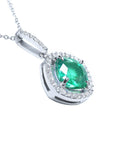 Emerald cushion cut gemstone pendant on a right-side profile gallery view.