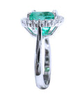 White gold cushion cut emerald ring, this image shows the top view, gallery and side profile of the ring's band.