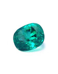 GIA certified 3.13 carat natural Colombian emerald with a cushion cut and vivid bluish-green hue.
