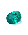 GIA certified 3.13 carat natural Colombian emerald with a cushion cut and vivid bluish-green hue.