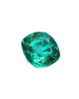 GIA certified 1.62 carat cushion cut emerald with vibrant medium-deep bluish-green hue.