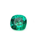 Cushion cut loose emerald from muzo Colombia, sparkling medium-deep bluish green color.